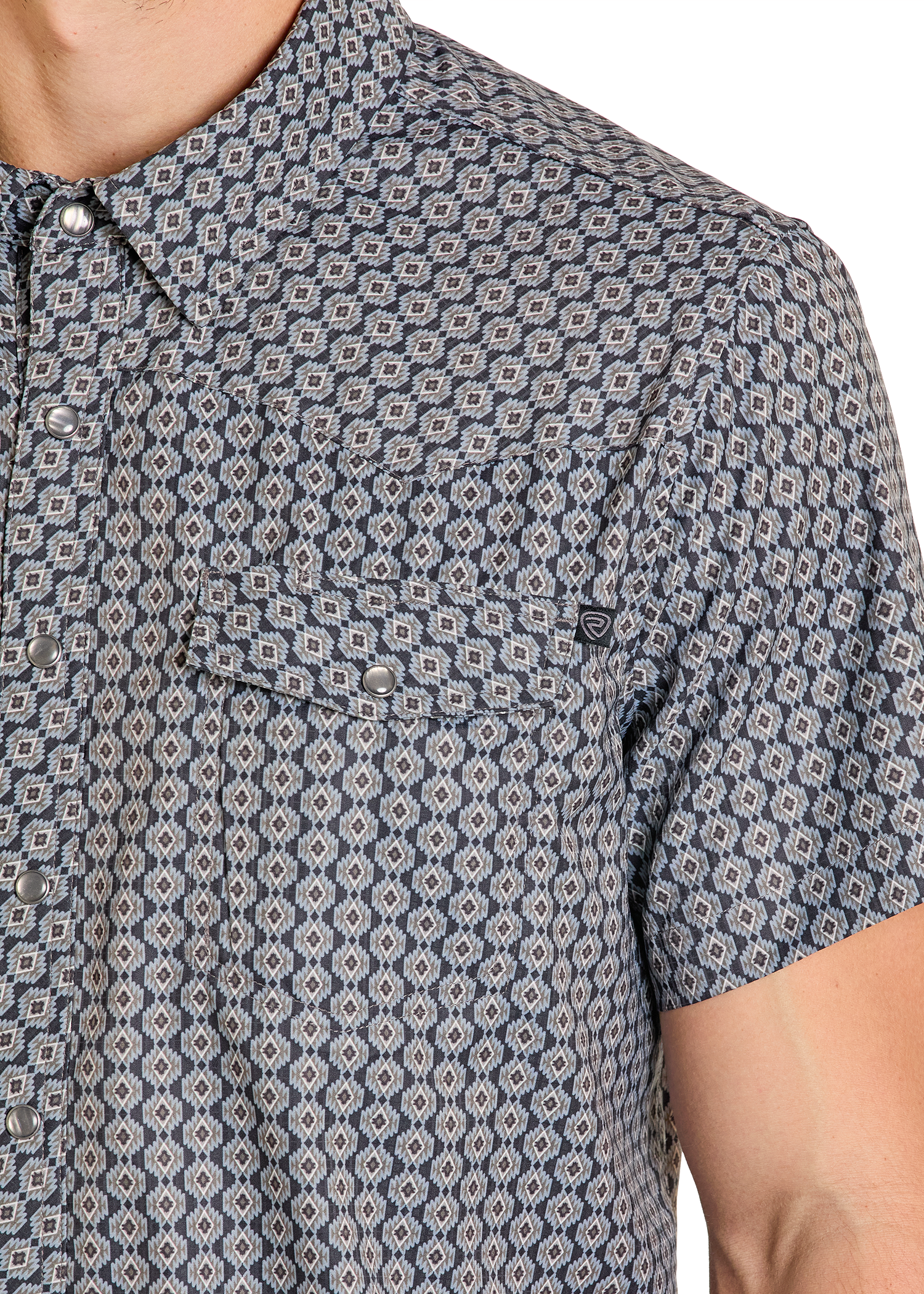 Close-up of a patterned shirt with geometric design