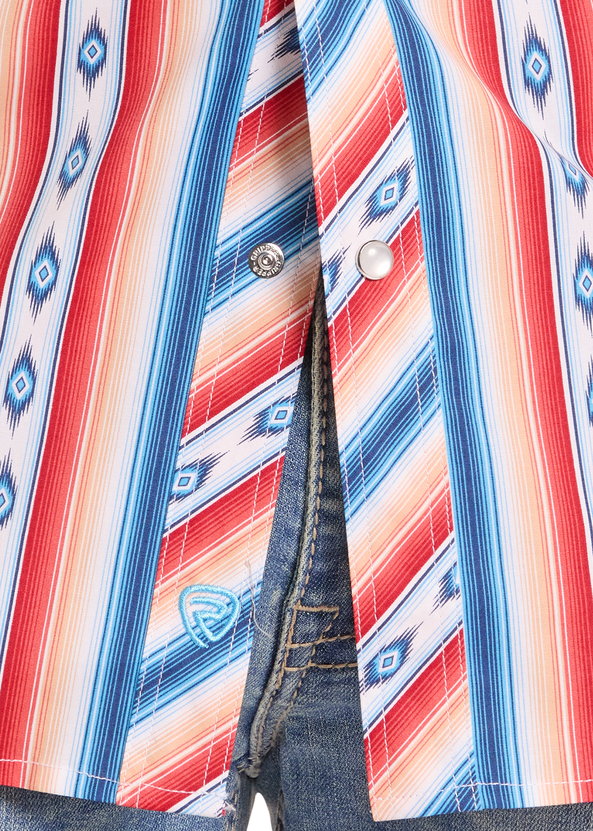 Close-up of a colorful striped shirt with a patterned collar and blue jeans.