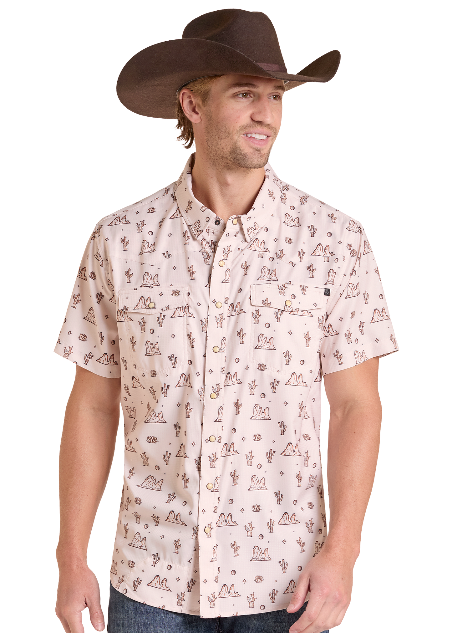 A man wearing a light beige short-sleeve button-up shirt with a brown western-style cactus and mountain print, paired with a brown cowboy hat, shown against a plain white background.
