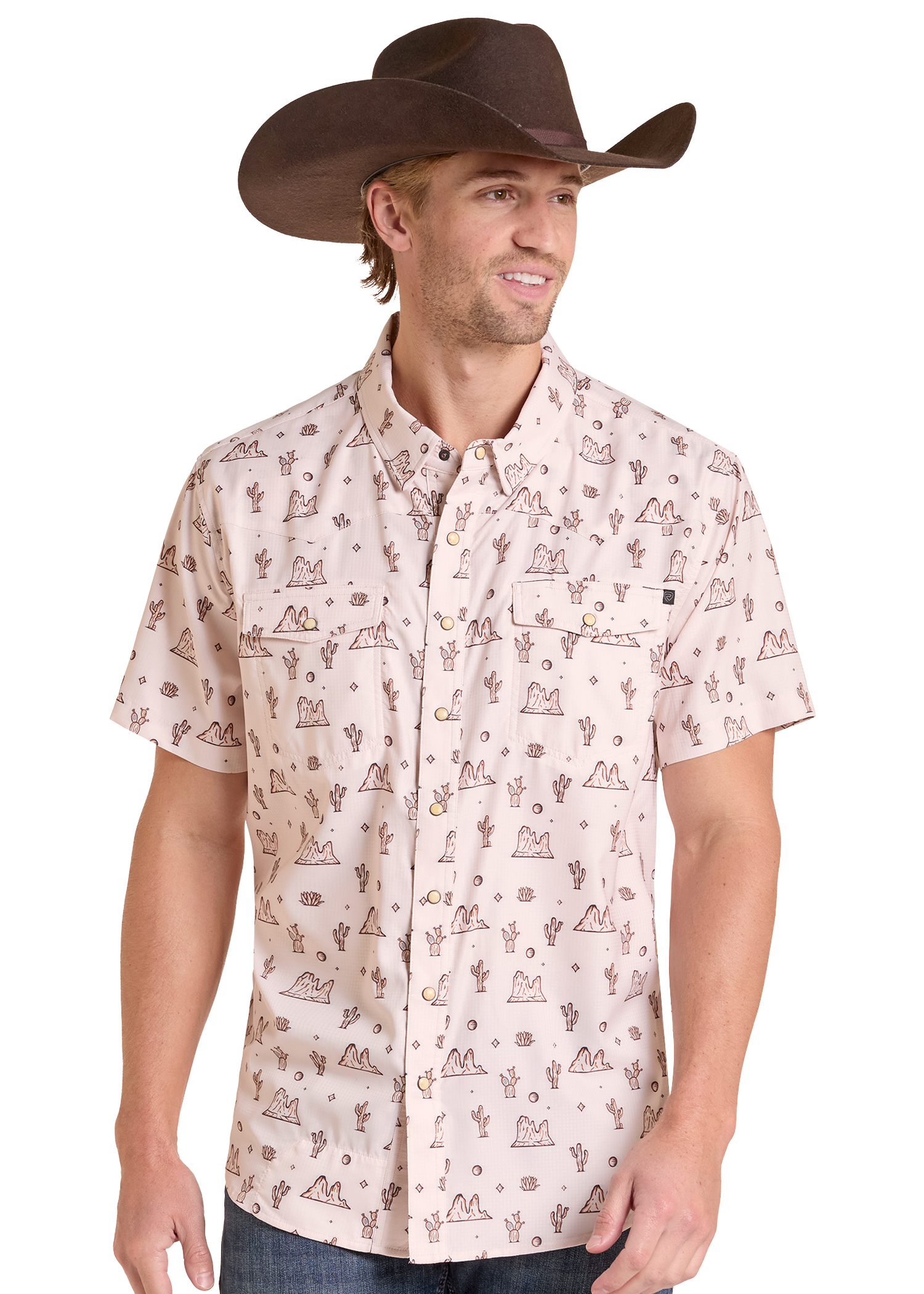 A man wearing a light beige short-sleeve button-up shirt with a brown western-style cactus and mountain print, paired with a brown cowboy hat, shown against a plain white background.