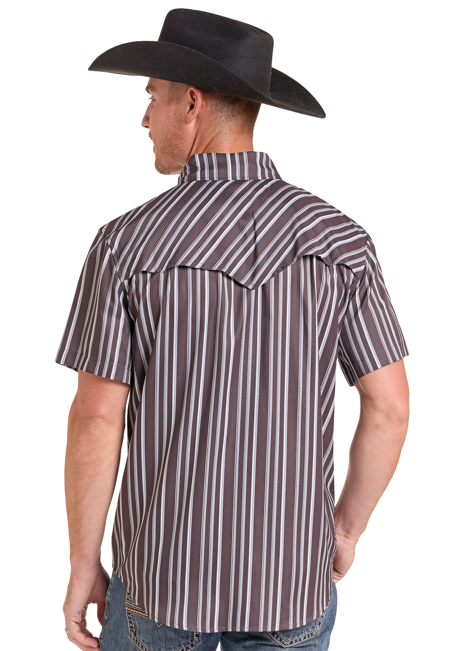 A man wearing a brown and white vertically striped short-sleeve western shirt, viewed from the back, paired with a black cowboy hat and blue jeans against a white background.