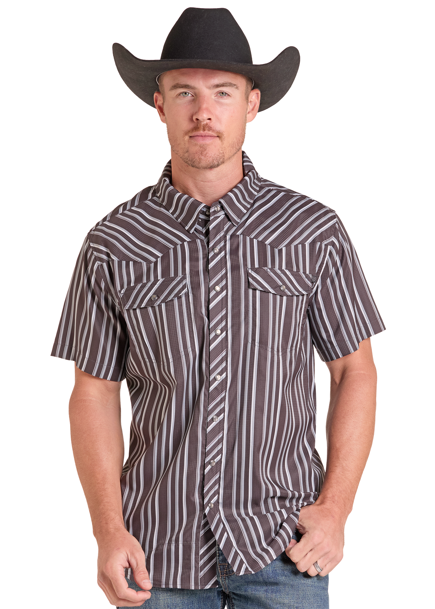 A man wearing a brown and white vertically striped short-sleeve western shirt with a matching striped tie and a black cowboy hat, photographed against a plain white background.