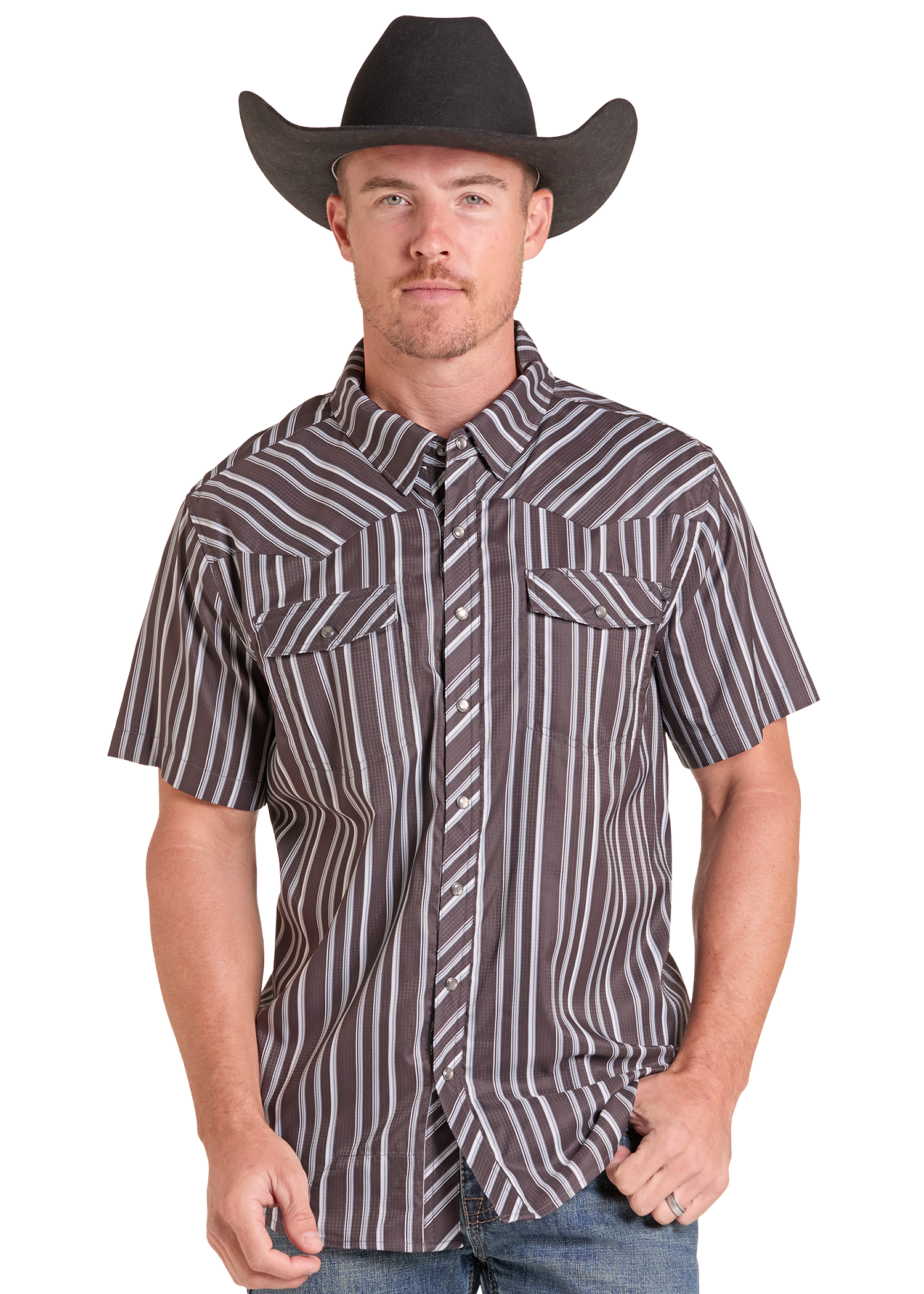 A man wearing a brown and white vertically striped short-sleeve western shirt with a matching striped tie and a black cowboy hat, photographed against a plain white background.
