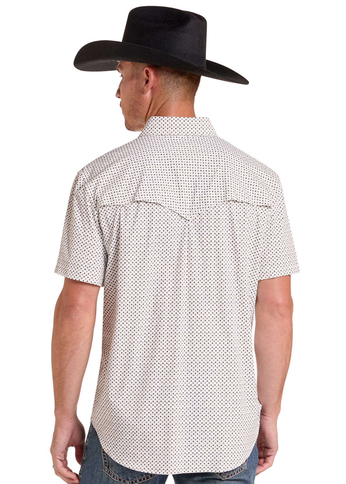 A man wearing a white short-sleeve western shirt with a small black geometric pattern, shown from the back. He is also wearing a black cowboy hat and blue jeans, photographed against a solid white background.
