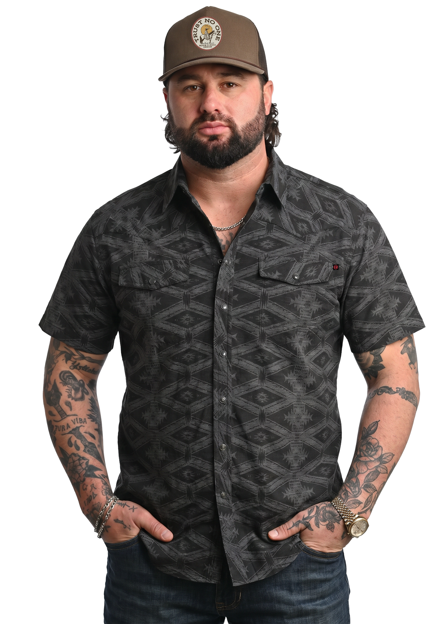 Koe Wetzel wearing a patterned shirt on a white background. 