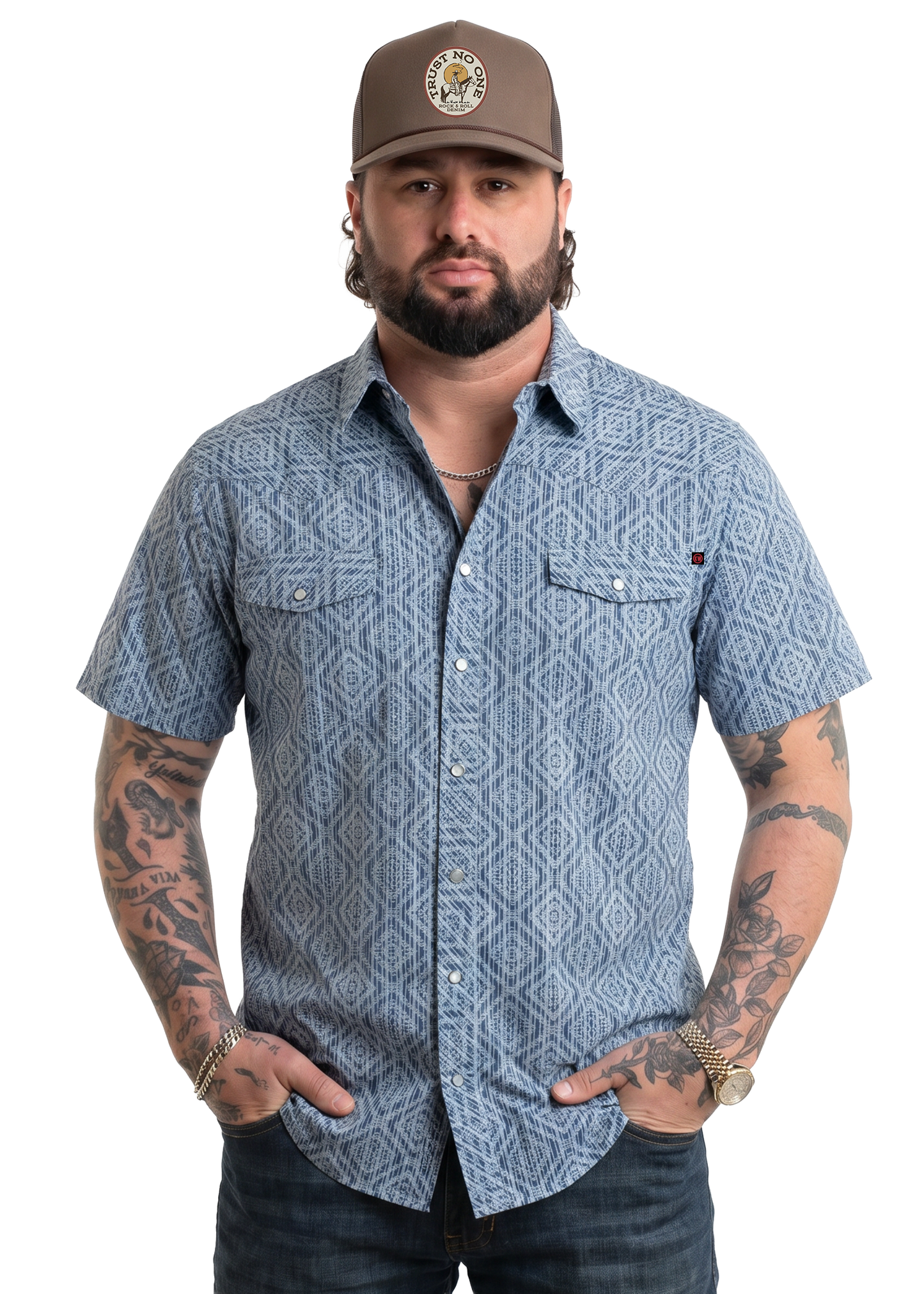 Koe Wetzel wearing a blue patterned shirt with tattoos on his arms, on a white background