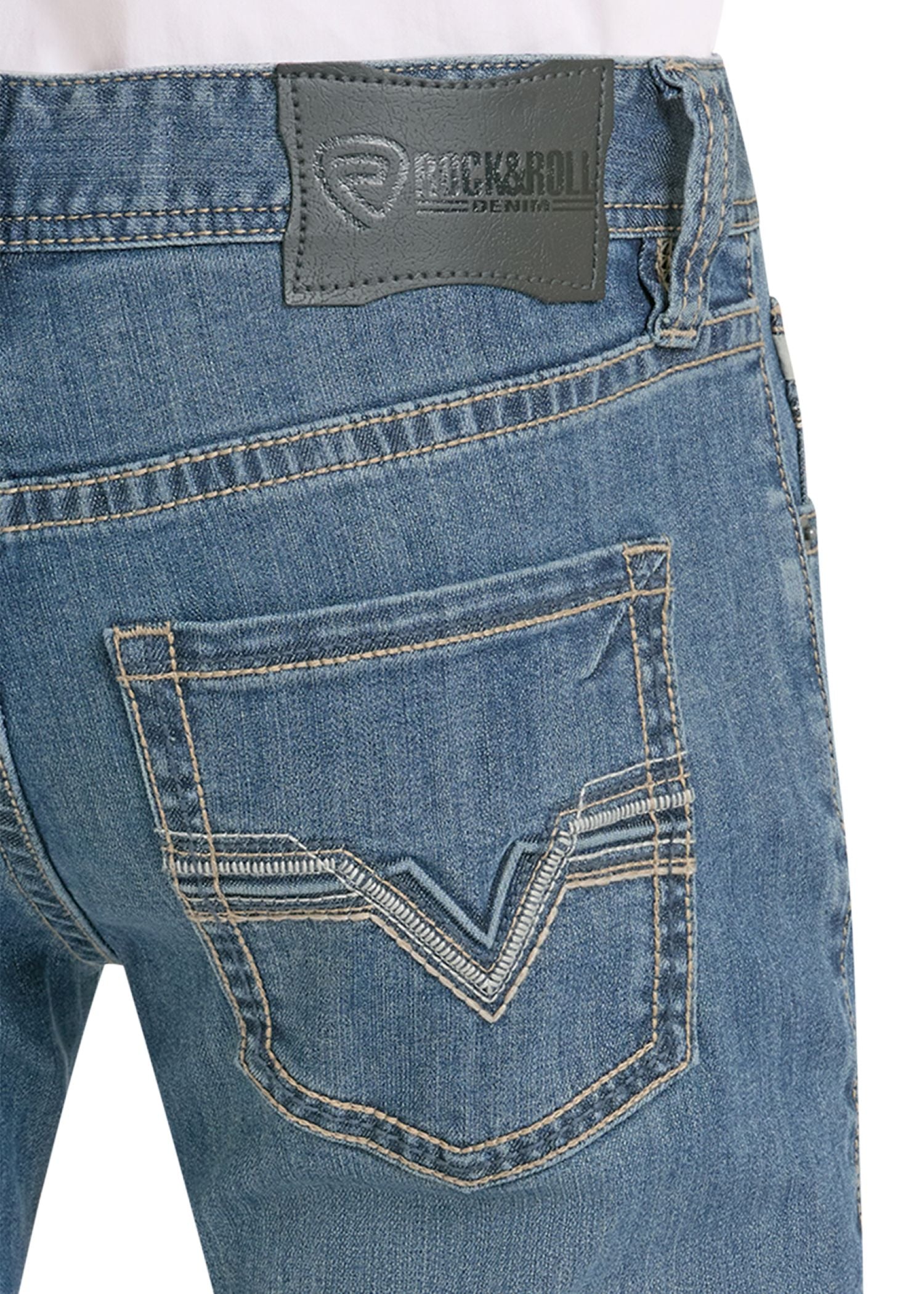 Close-up of blue jeans with a brand label on a white background