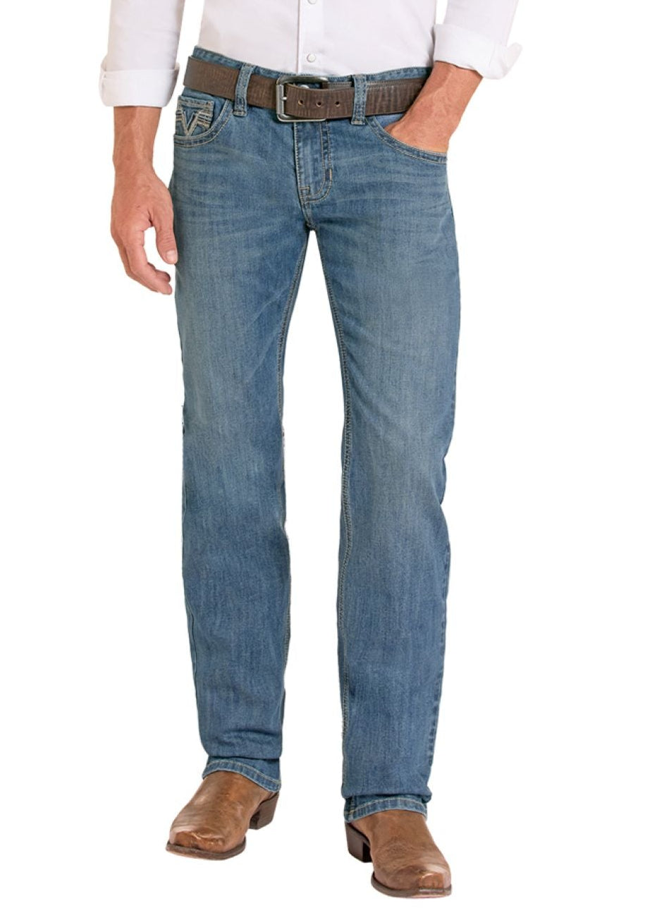 Man wearing a white shirt, blue jeans, and cowboy boots on a white background