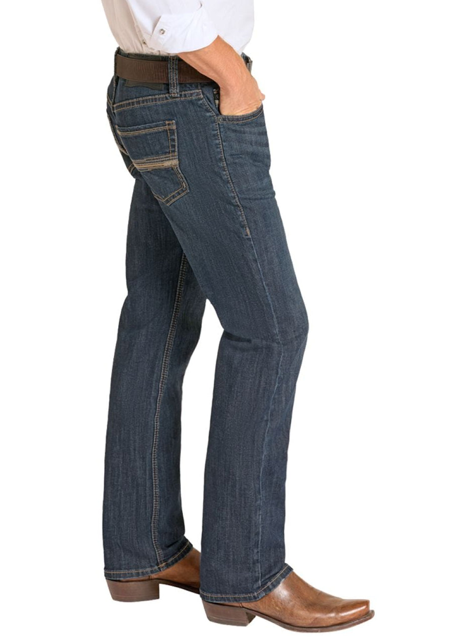 Man wearing a white shirt, blue jeans, and cowboy boots on a white background
