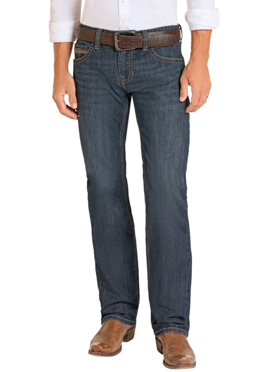Man wearing a white shirt, blue jeans, and cowboy boots on a white background