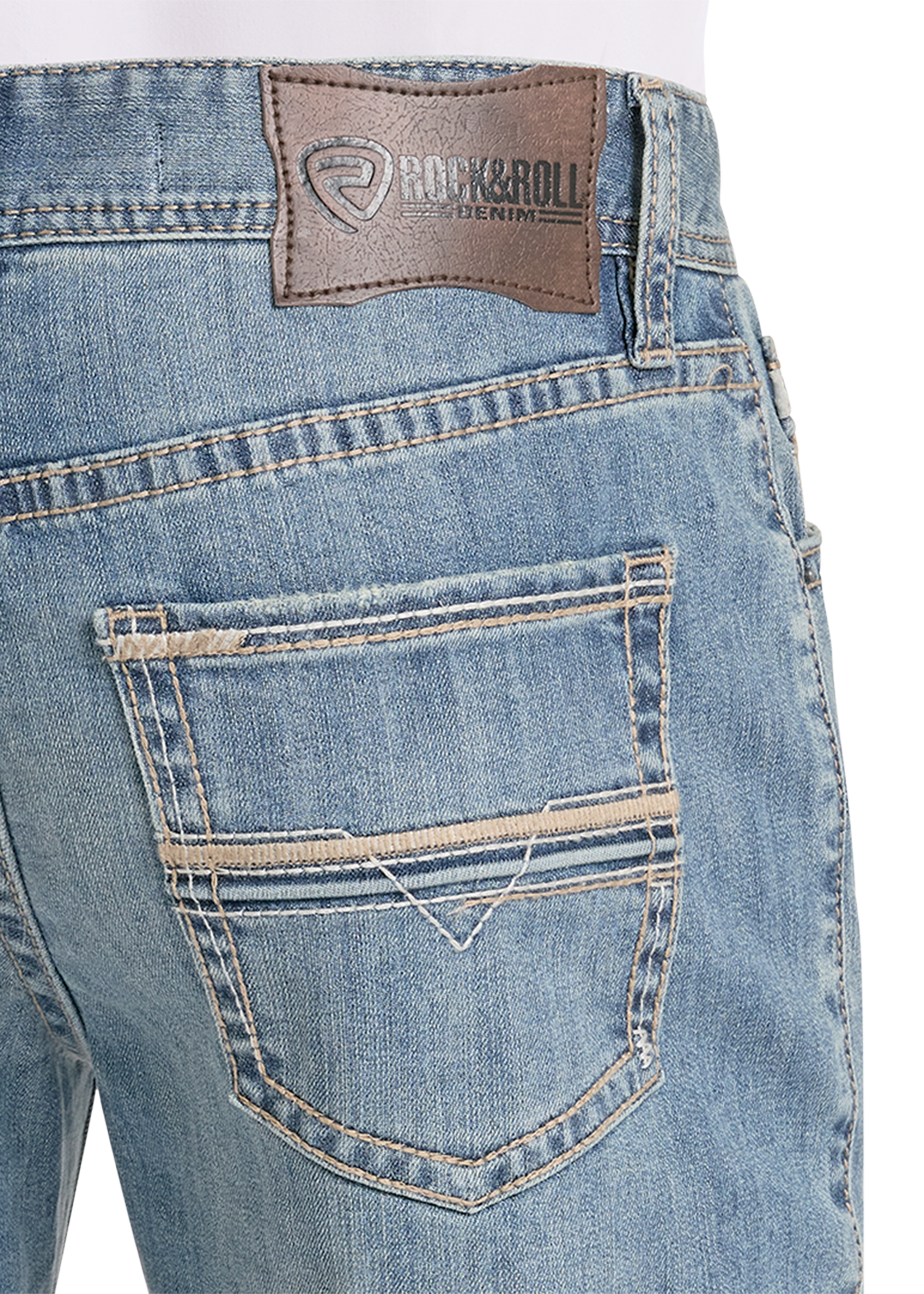Close-up of blue jeans with a brand label on a white background