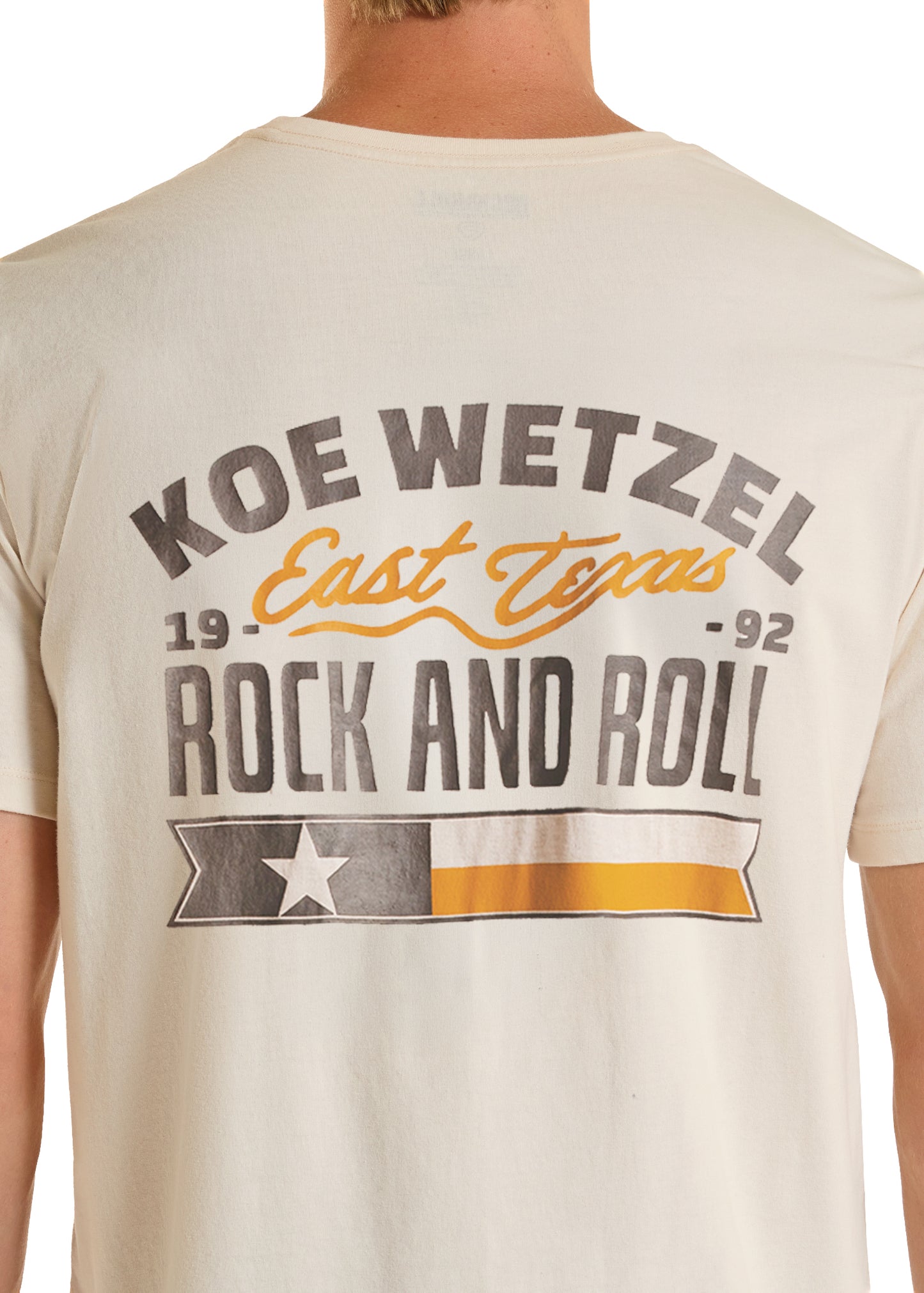 Beige t-shirt with 'Koe Wetzel East Texas Rock and Roll' text and graphics on a plain background