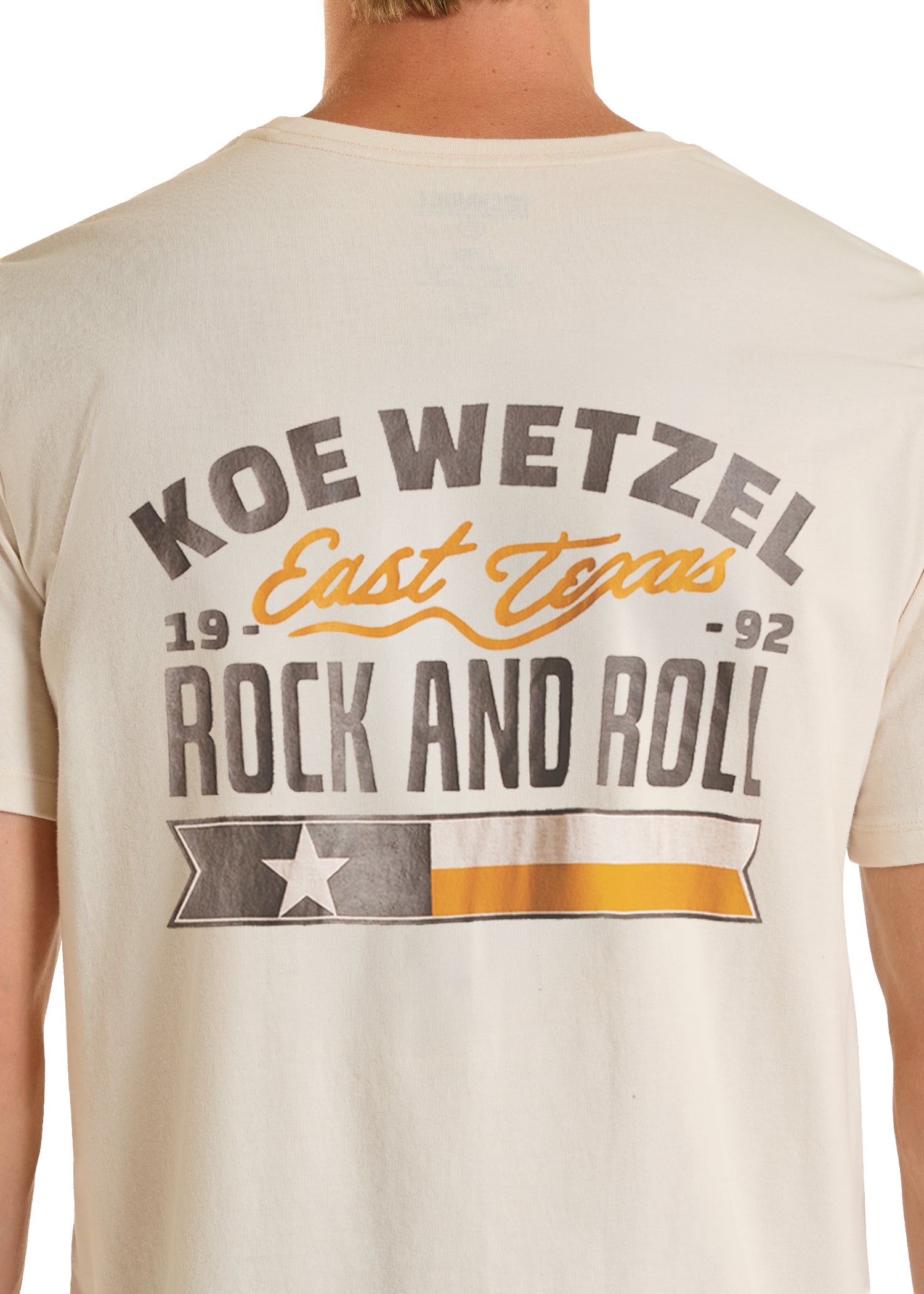 Beige t-shirt with 'Koe Wetzel East Texas Rock and Roll' text and graphics on a plain background