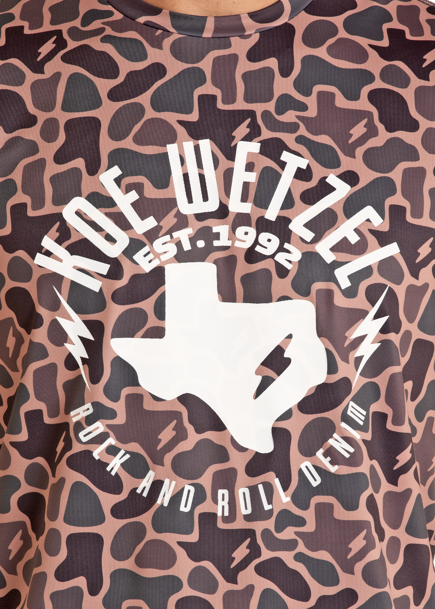 T-shirt with 'Koe Wetzel' logo and text on a camouflage pattern
