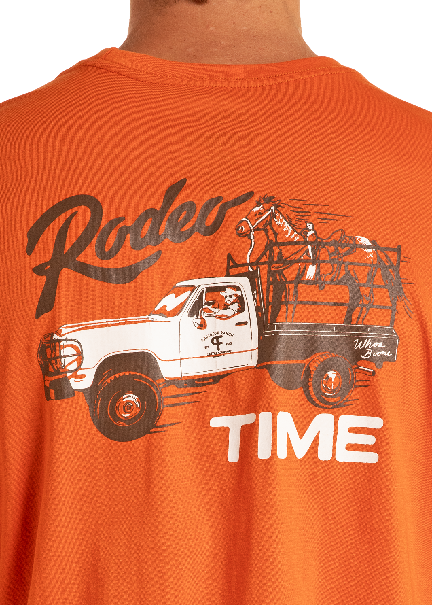 Orange t-shirt with a graphic of a truck and horse, and the text 'Rodeo Time'.