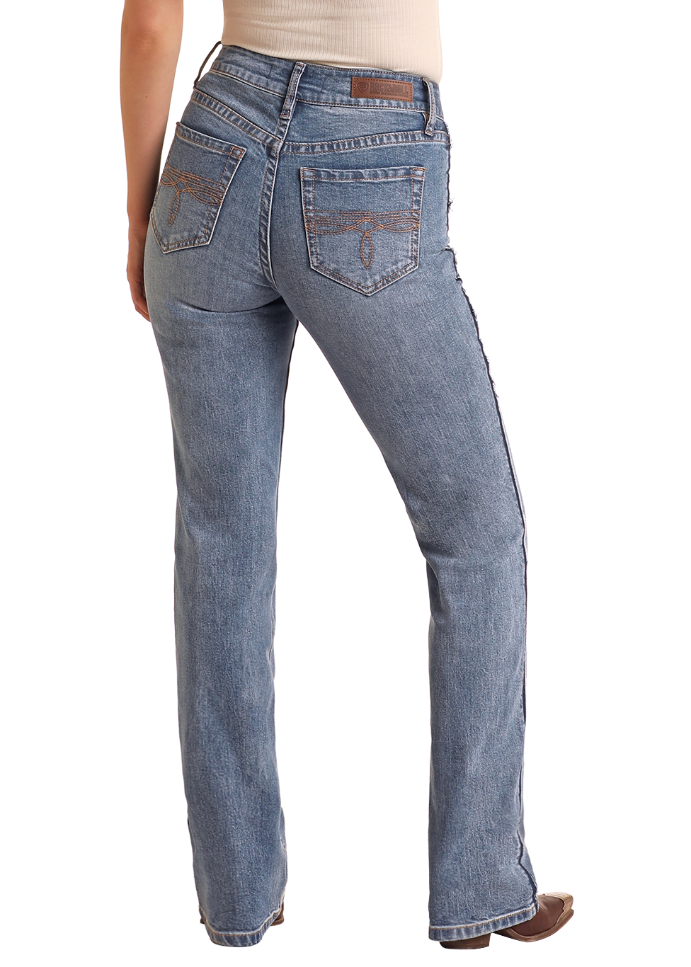 Woman wearing blue jeans and a beige hat on a white background