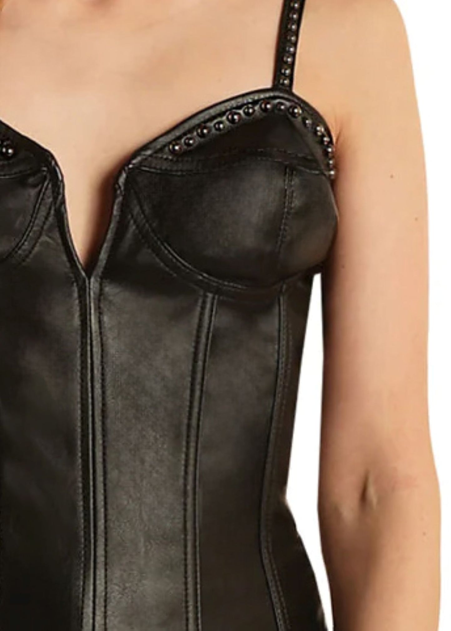 A close-up shows a person wearing the Rock & Roll Denim Leather Corset Tank Top in black faux leather with studded detailing and thin straps, highlighting the upper torso against a white background.