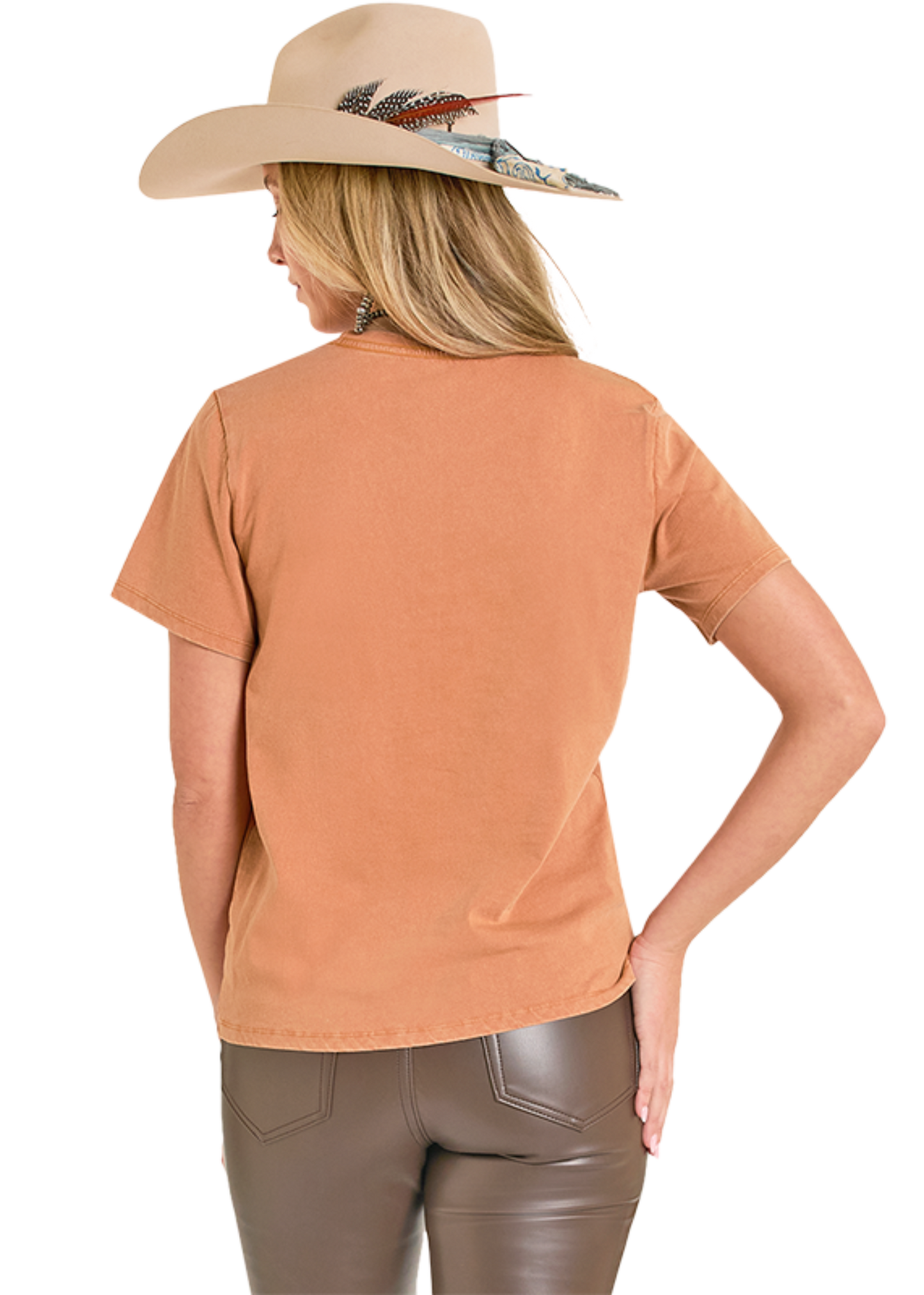 Woman wearing a tan hat with feathers and an orange shirt on a white background