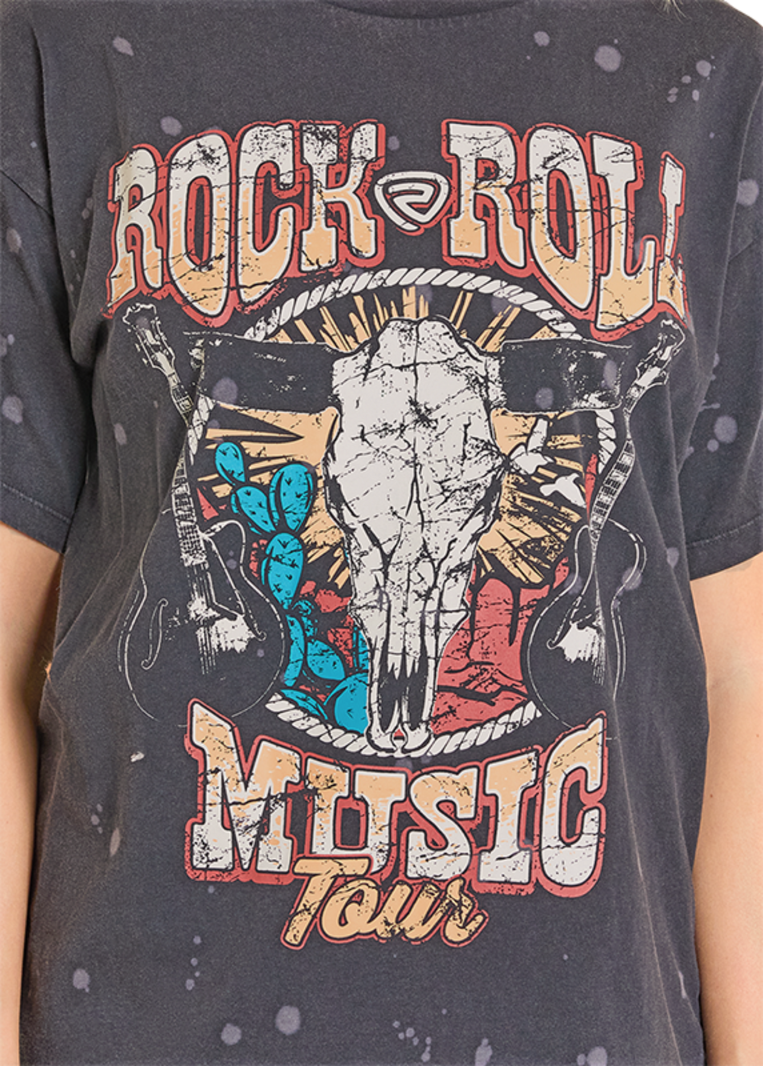 T-shirt with a graphic design of a skull, guitars, and 'Rock & Roll Music Tour' text on a dark background.