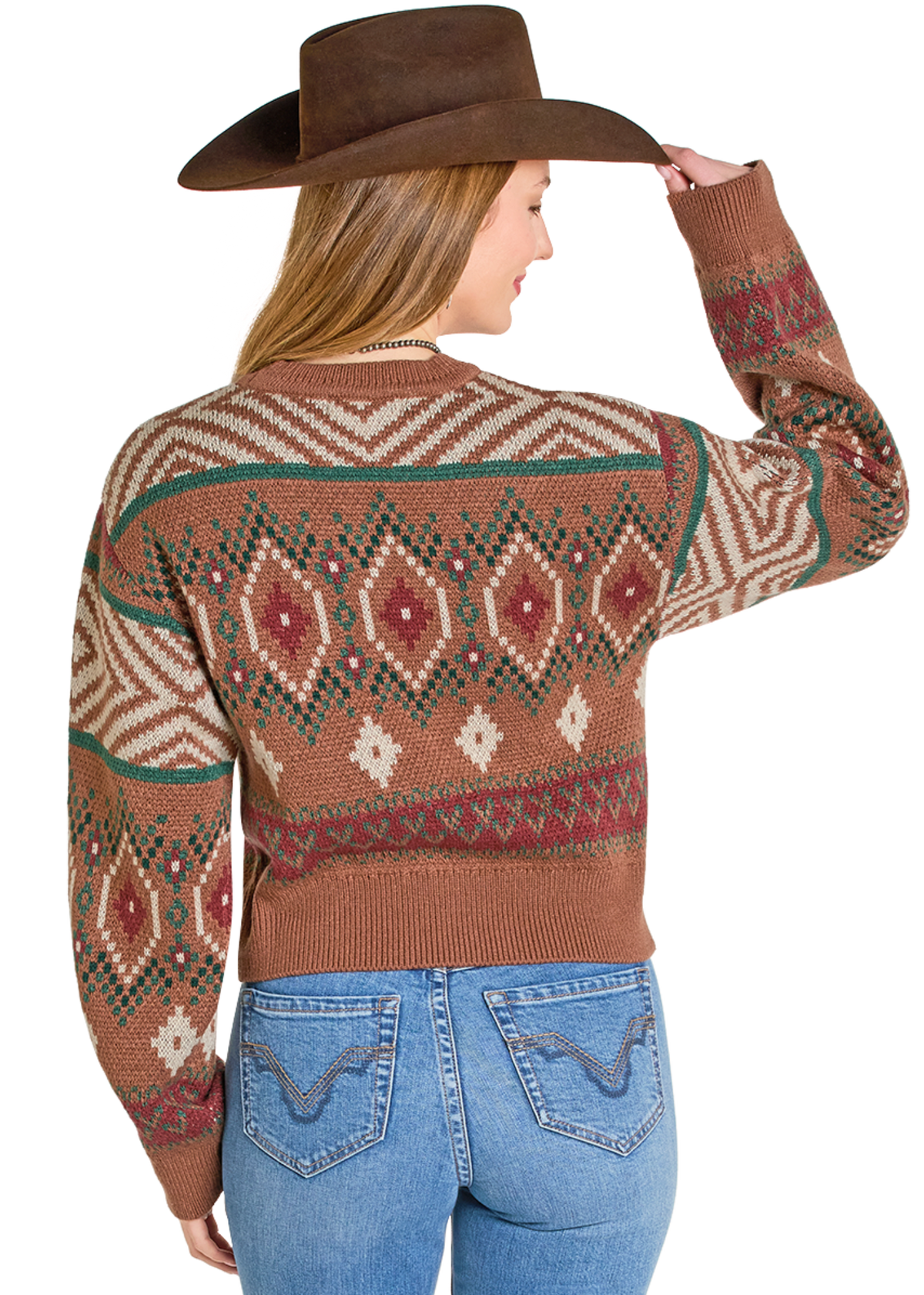 Woman wearing a patterned sweater and cowboy hat on a white background