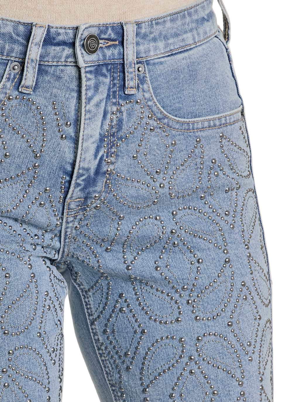 Close up of light blue jeans worn by a person on a white background