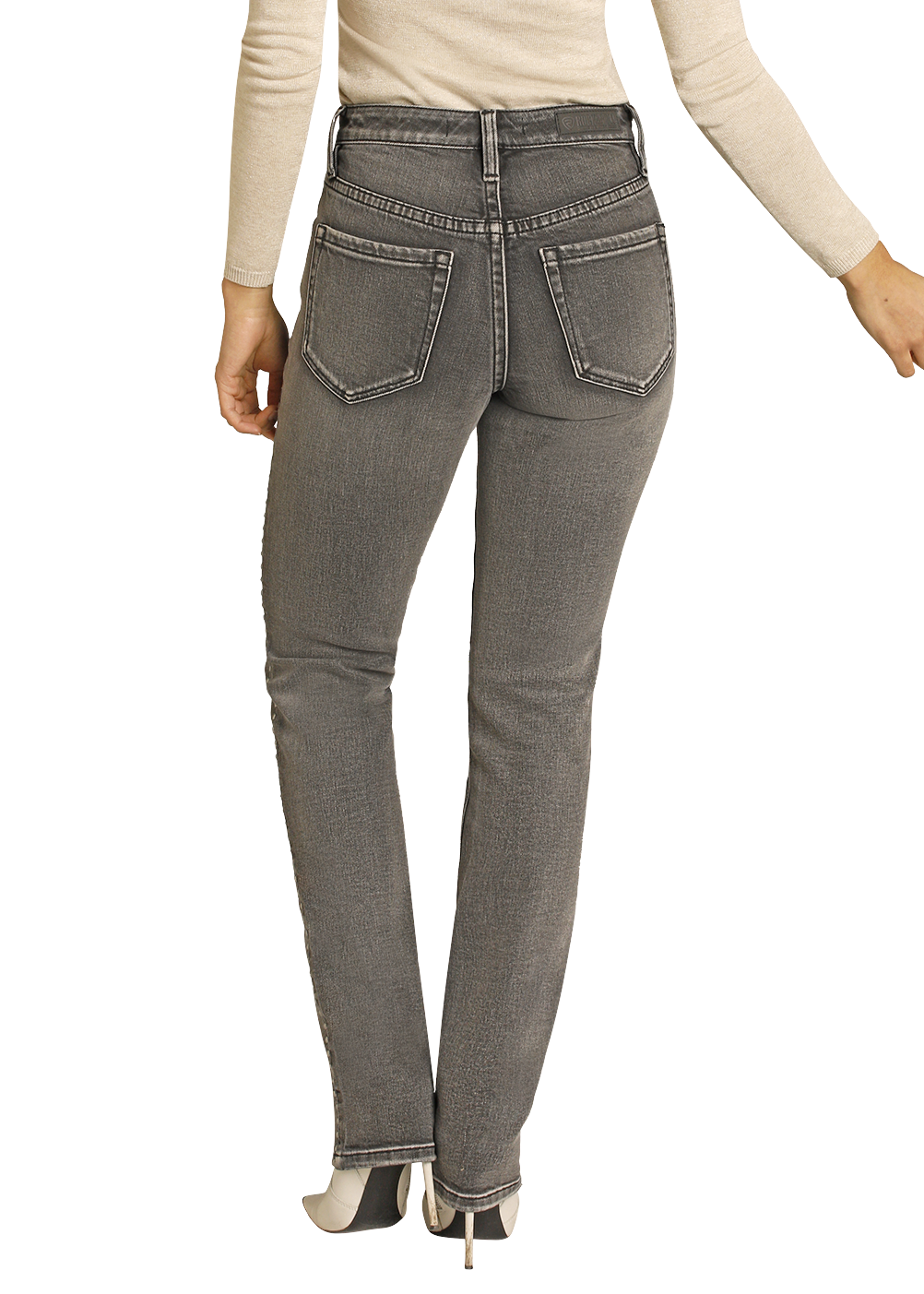 Woman wearing gray jeans and a black cowboy hat on a white background