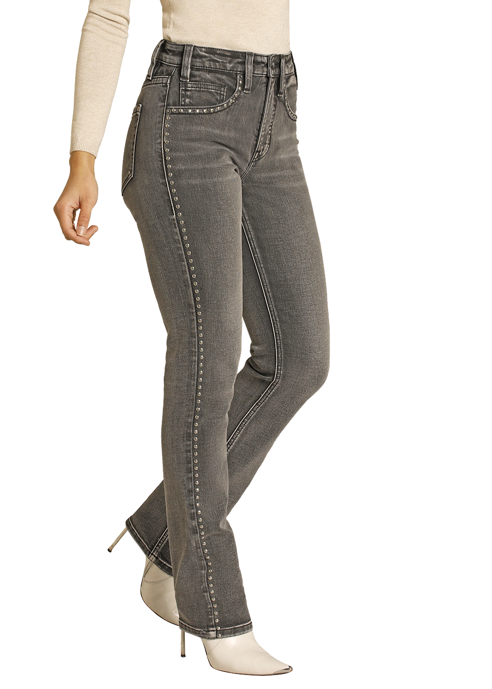 Woman wearing a beige long-sleeve top, gray jeans, and a black cowboy hat on a white background