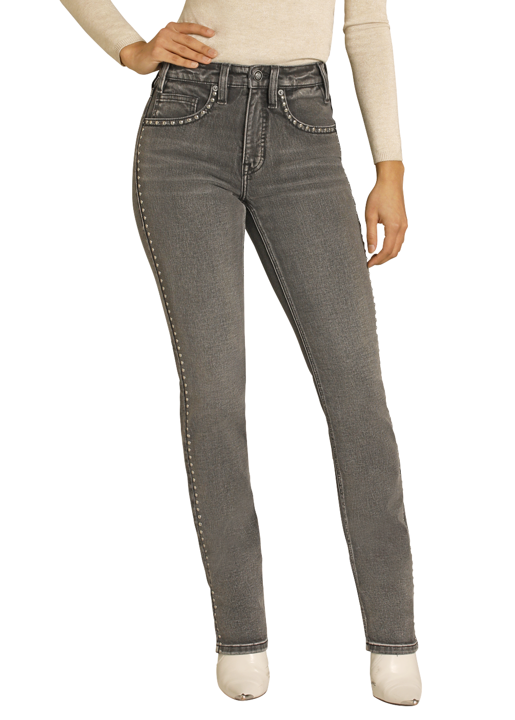 Woman wearing a beige long-sleeve top, gray jeans, and a black cowboy hat on a white background