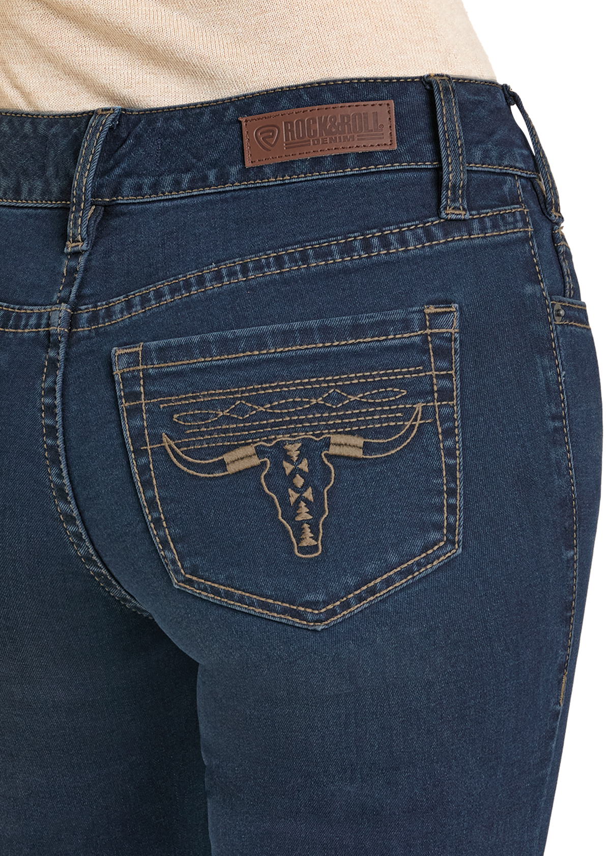 A close-up of the back pocket of Rock & Roll Denim Mid Rise Boot Stitch Steer Head Bootcut Jeans shows tan longhorn skull stitching with decorative patterns and a leather Rock & Roll Denim patch above the pocket.