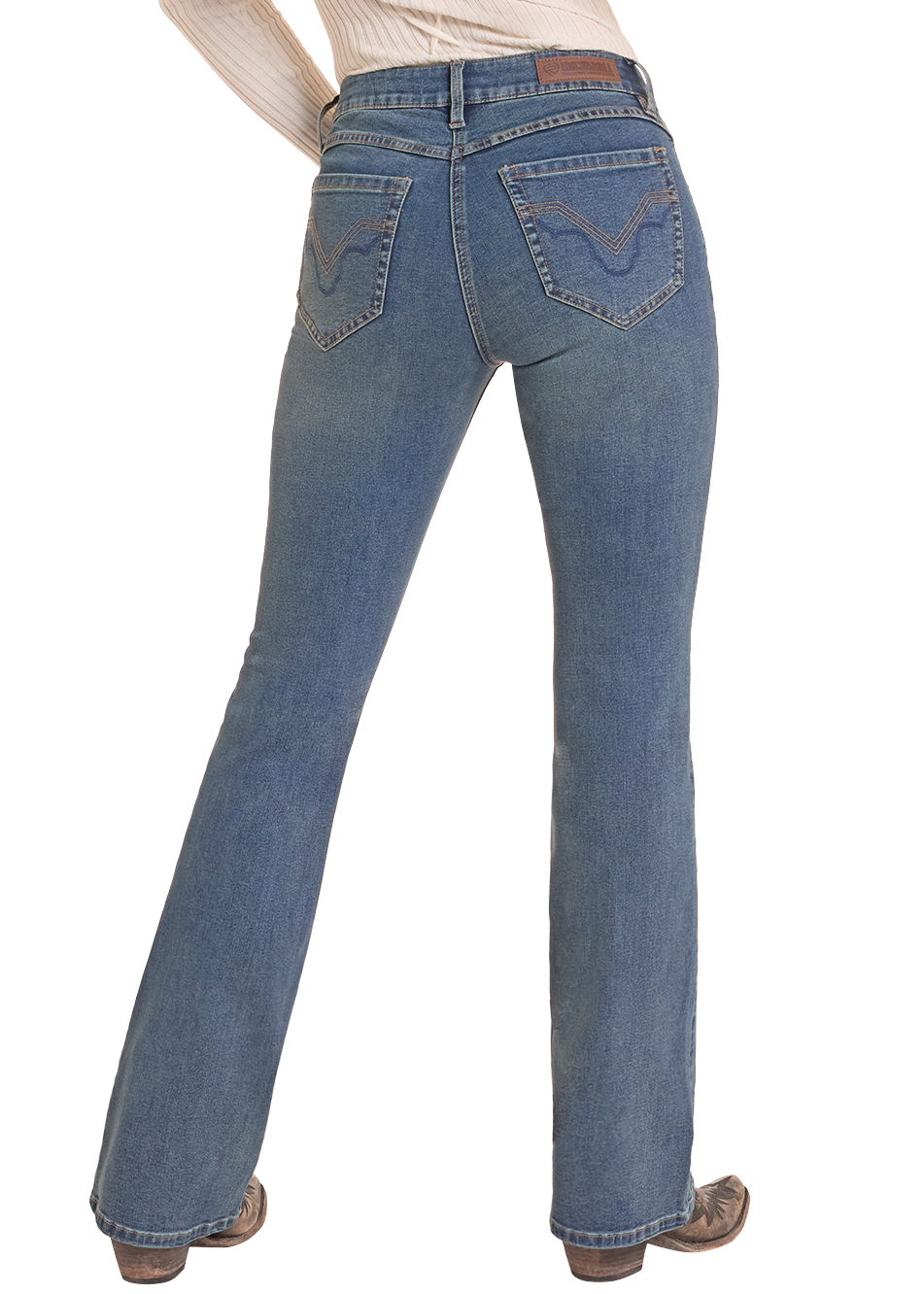 Rear view of a person wearing blue denim jeans with a flared leg, paired with a cream ribbed top and brown boots, against a plain white background.
