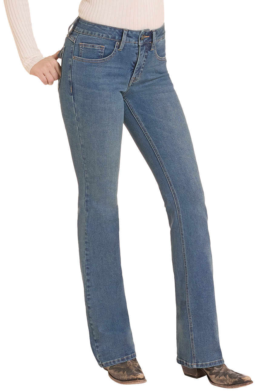 A person wearing medium-wash blue jeans with a straight-to-medium leg fit, paired with a cream ribbed long-sleeve top and brown cowboy boots, shown against a plain white background.