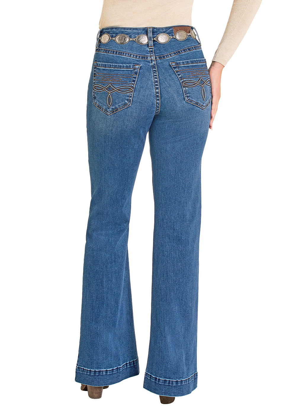 Woman wearing blue jeans and a beige top with a brown hat on a white background