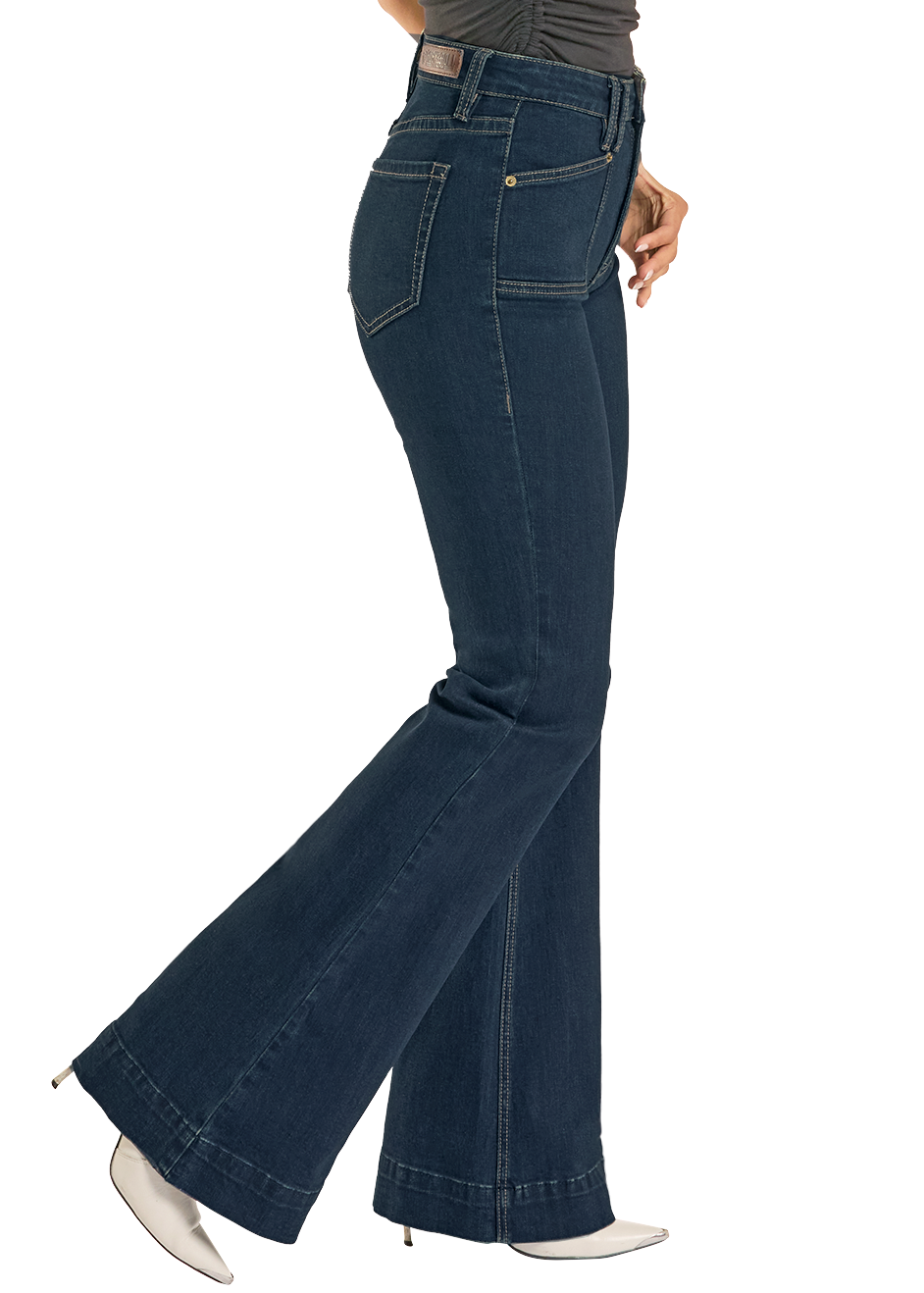 Blue flared jeans worn by a person on a white background