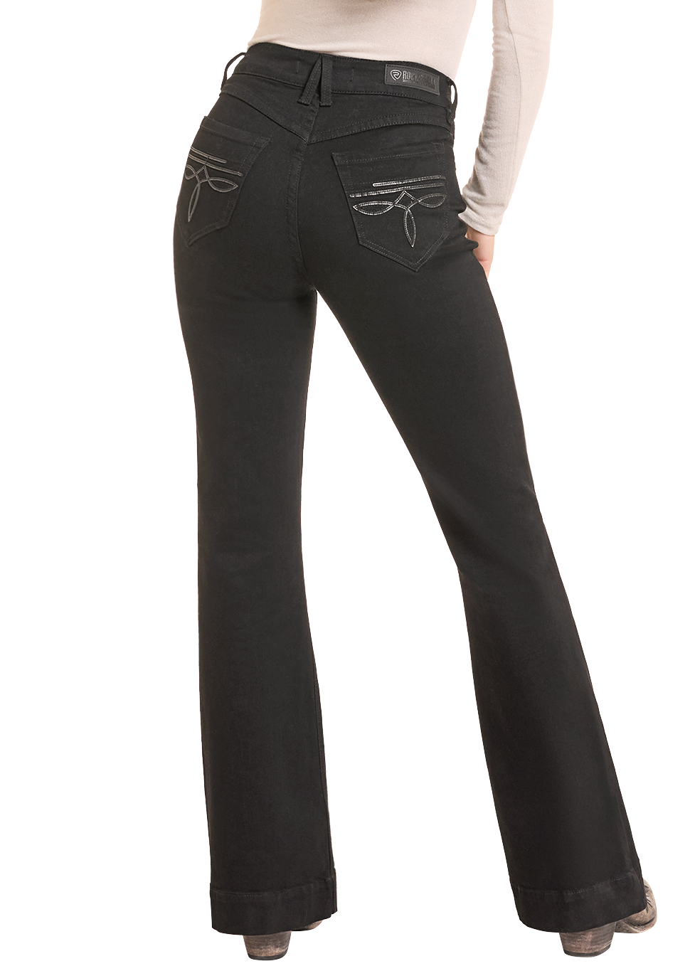 Back view of a Woman in black jeans with black leather detailing on the pocket.