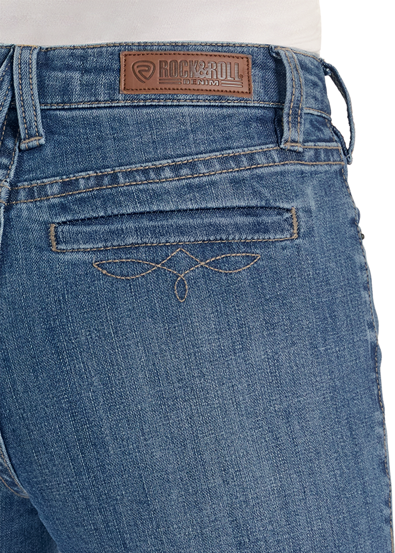 Close-up of blue jeans with a brand label on the back pocket.