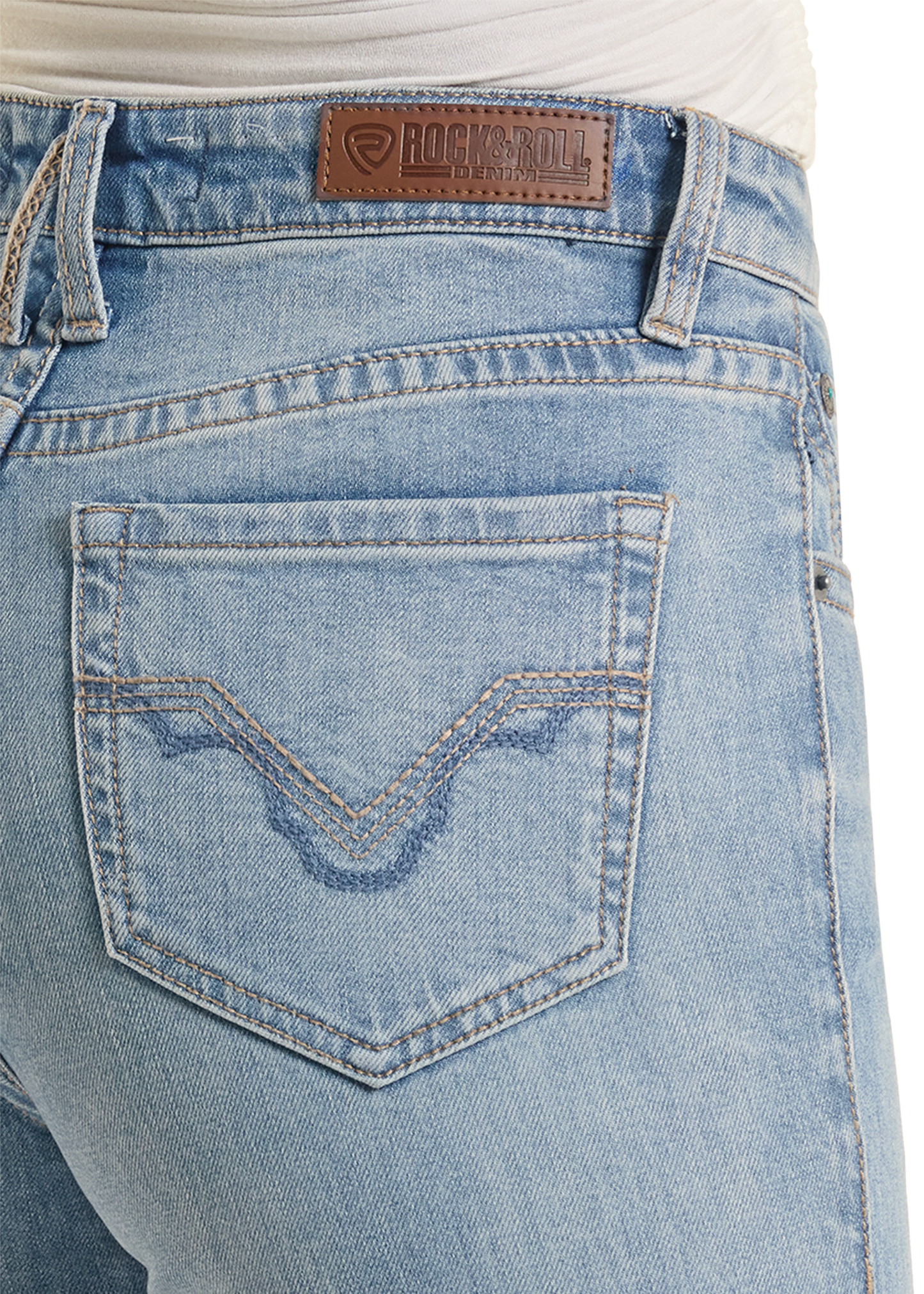 Close-up of blue jeans with a brand label on the pocket.