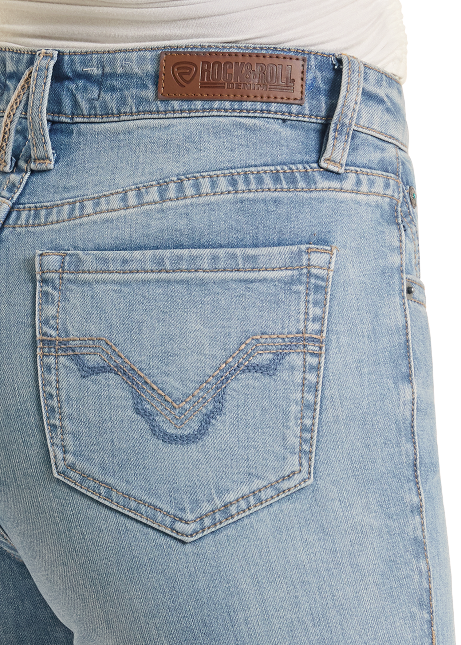 Close-up of blue jeans with a brand label on the pocket.