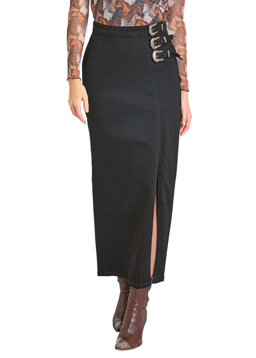 Woman wearing a floral top and black skirt with a cowboy hat on a white background