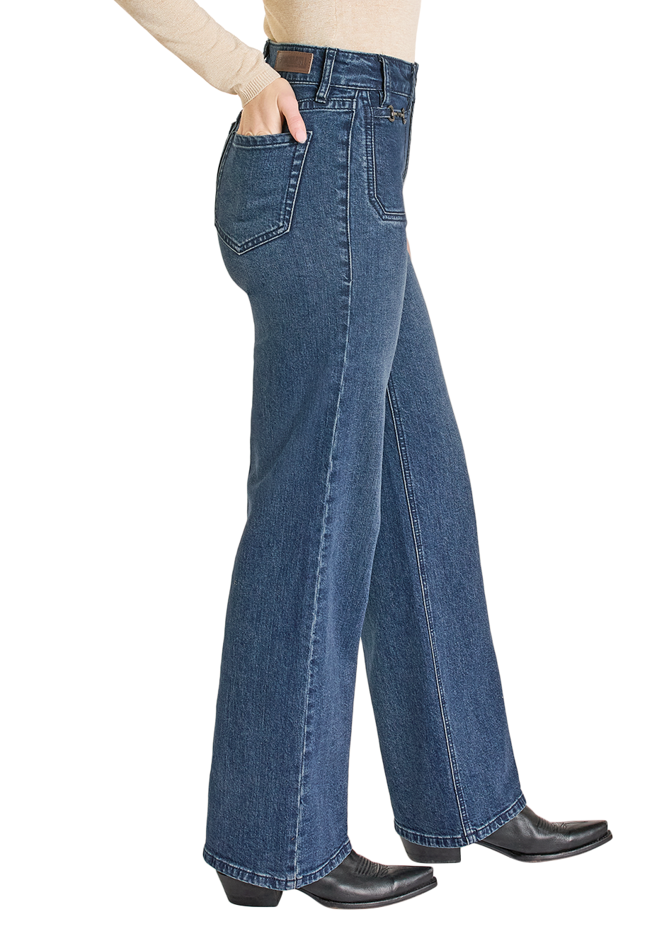 Woman wearing a black cowboy hat, beige top, and blue jeans on a white background