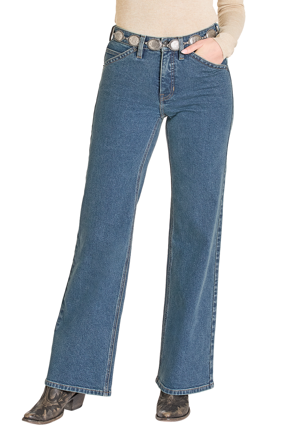 Woman wearing a black cowboy hat, beige top, and blue jeans on a white background