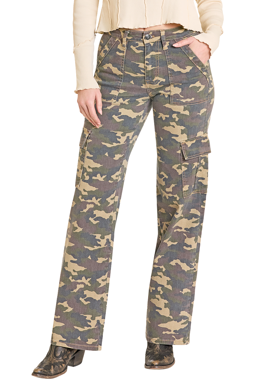 Woman wearing a beige cowboy hat, cream jacket, and camouflage pants on a white background