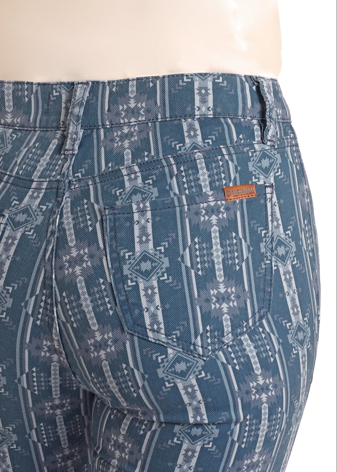 Blue patterned pants on a mannequin with a white background