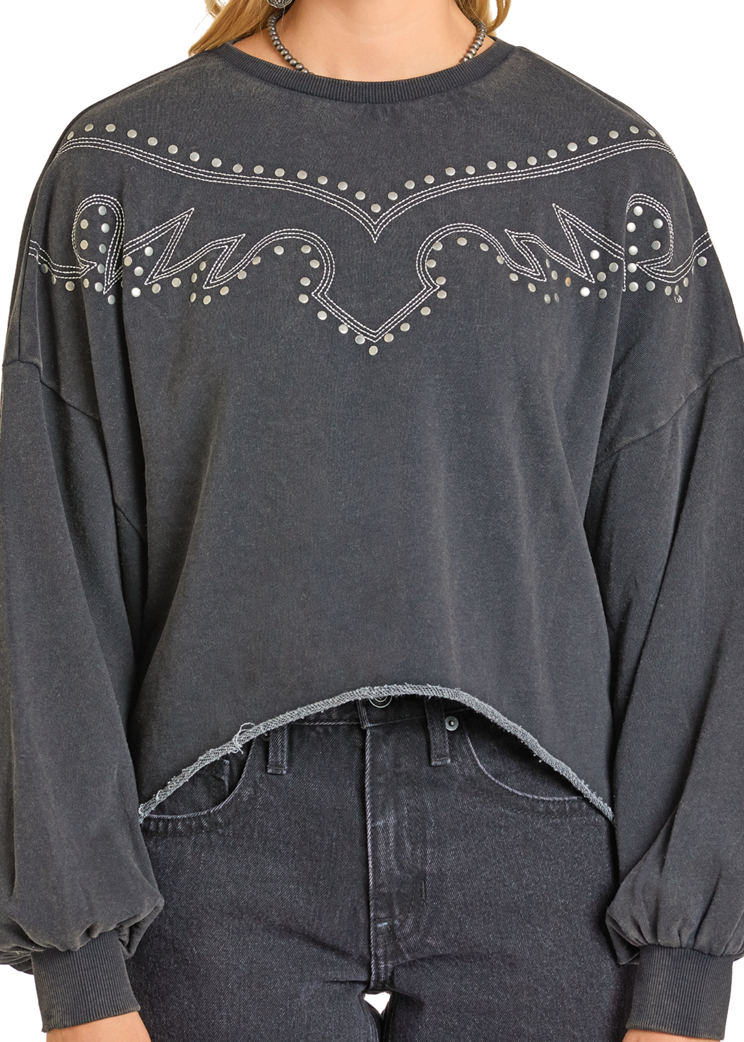 Dark gray sweatshirt with decorative patterns on a plain background