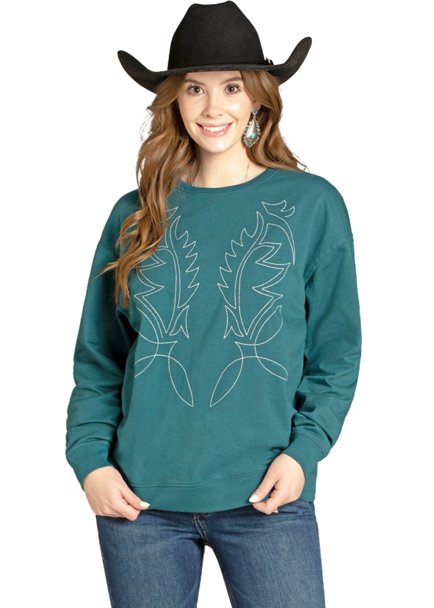 Woman wearing a teal long-sleeve shirt with a design and blue jeans on a white background