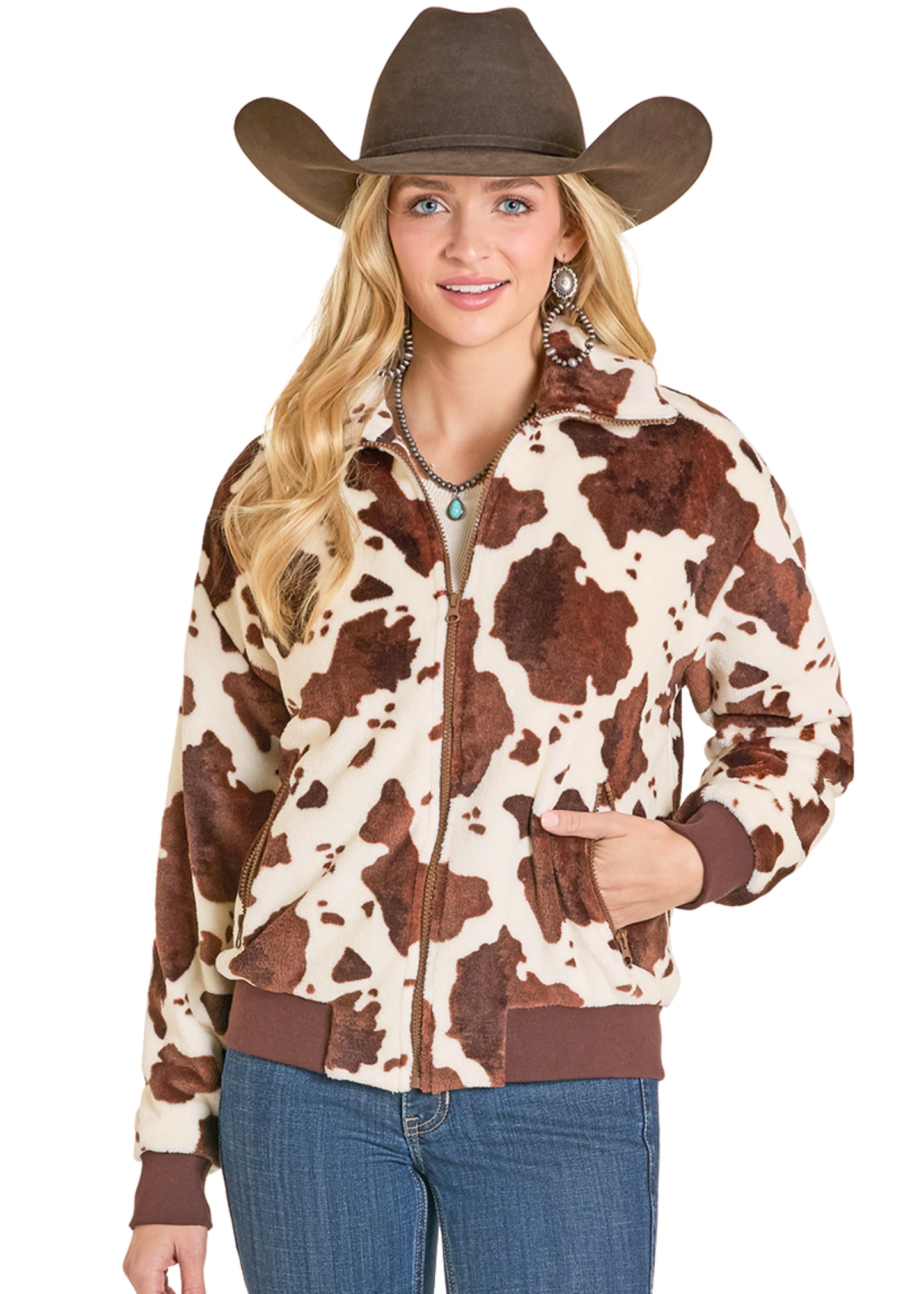 Woman wearing a cow print jacket and brown cowboy hat on a white background