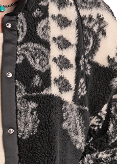 close up of a paisley sherpa jacket with snaps