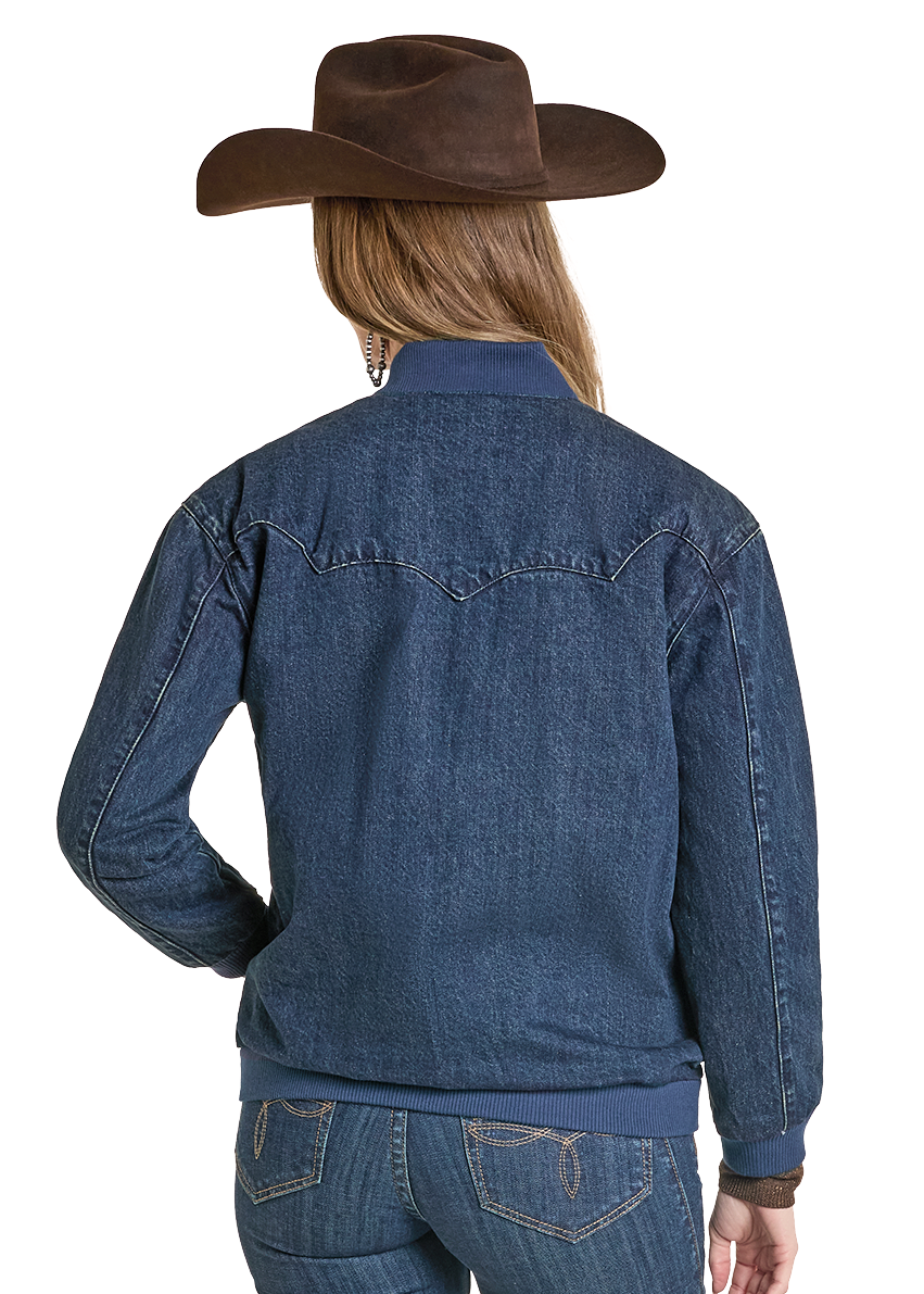 Person wearing a blue denim jacket and jeans with a brown cowboy hat on a white background