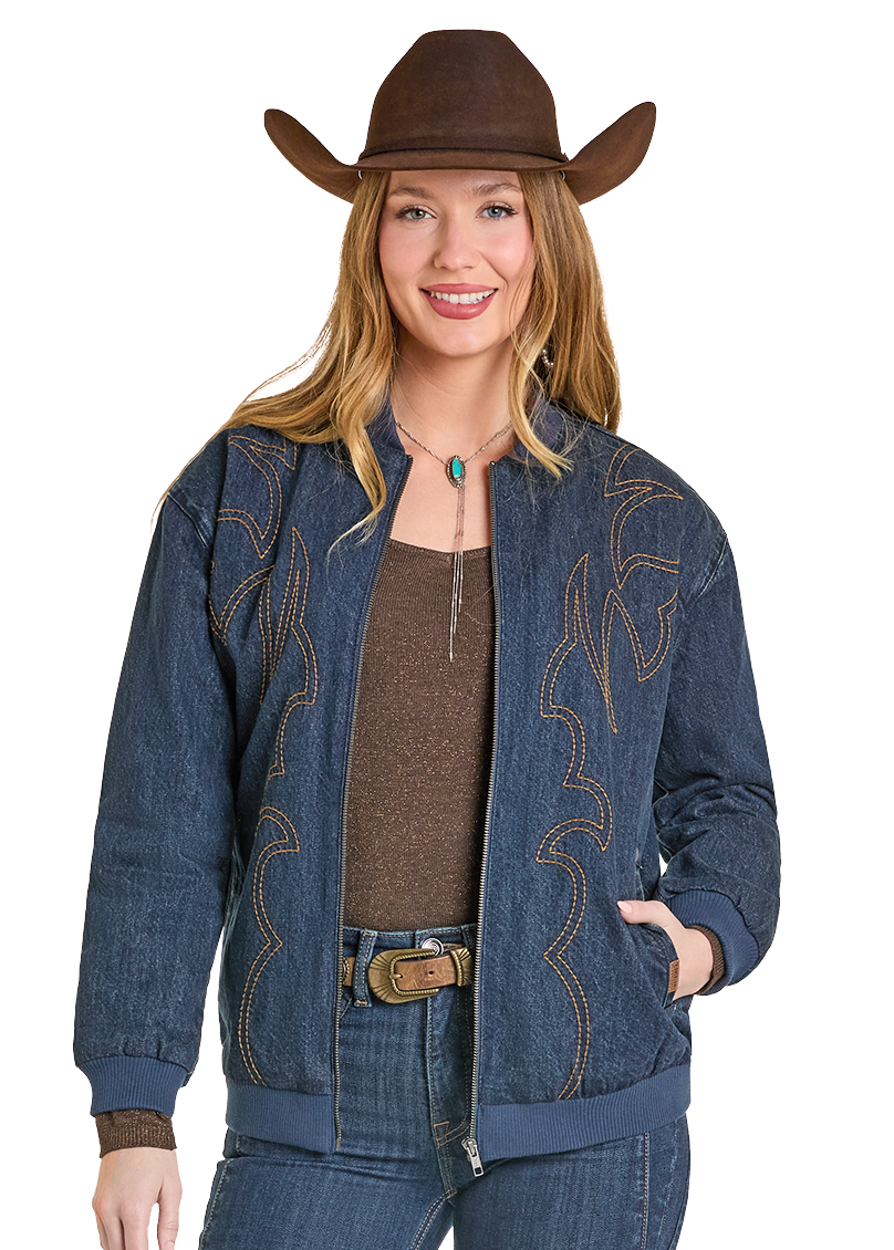Woman wearing a blue denim outfit with a cowboy hat on a white background