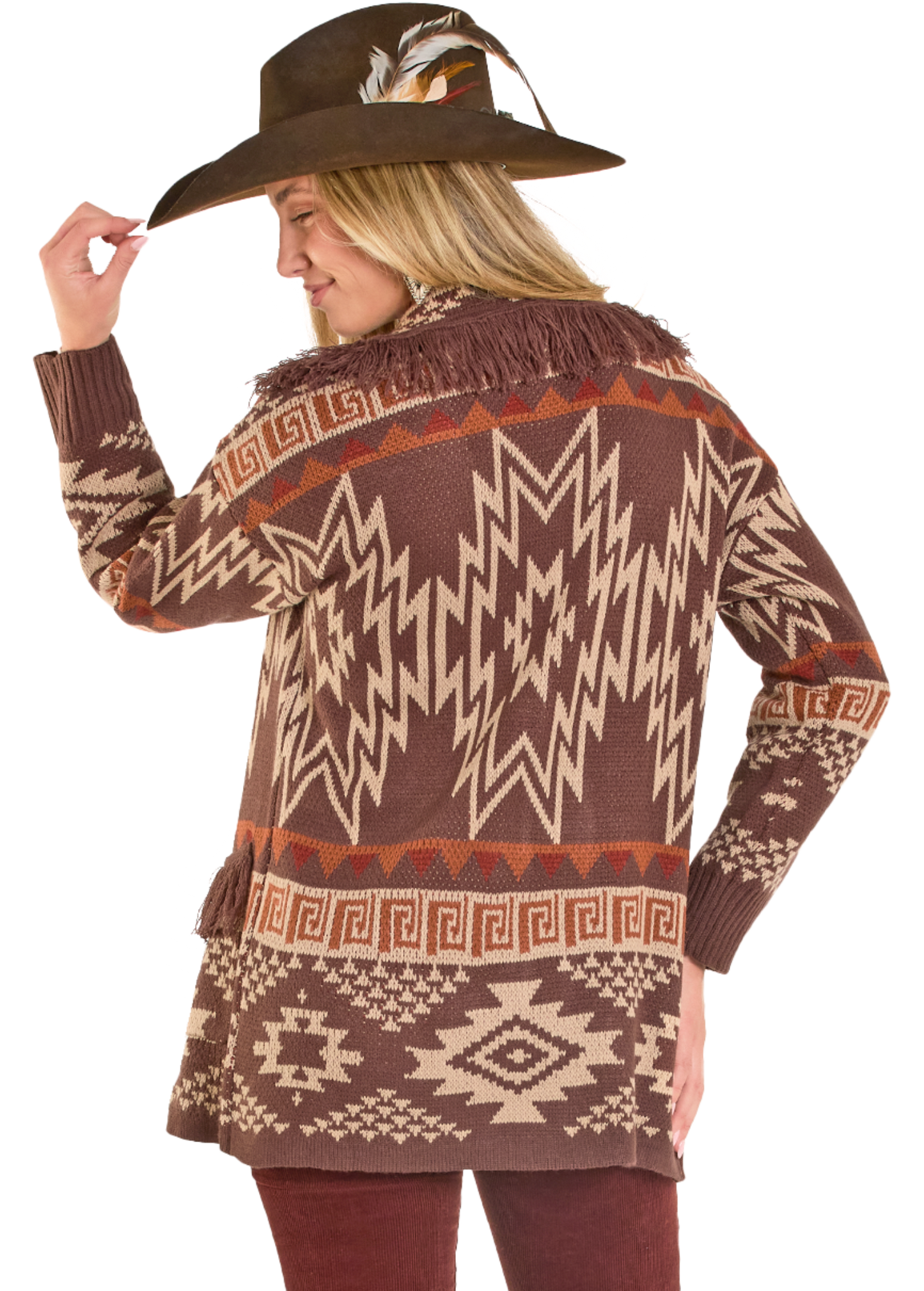 Woman wearing a patterned sweater and hat on a white background