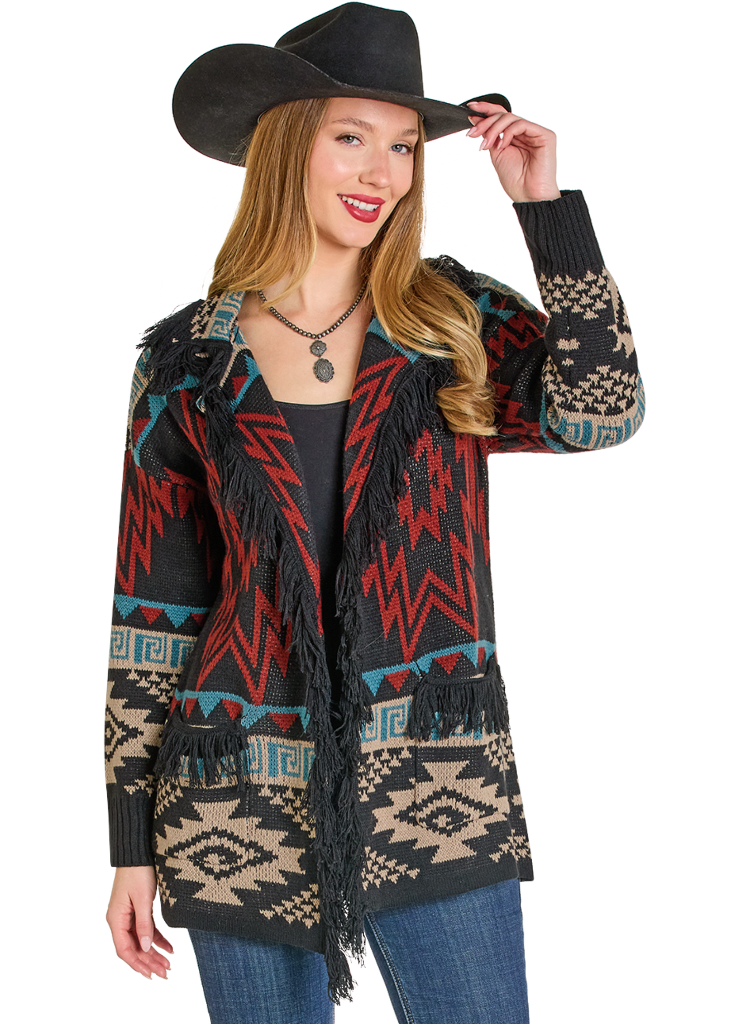 Woman wearing a patterned jacket with fringes and a cowboy hat on a white background